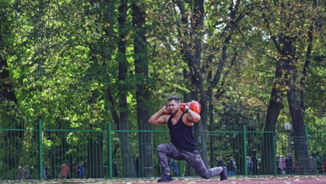 man training at stadium. fit athlete doing exercises at stadium
