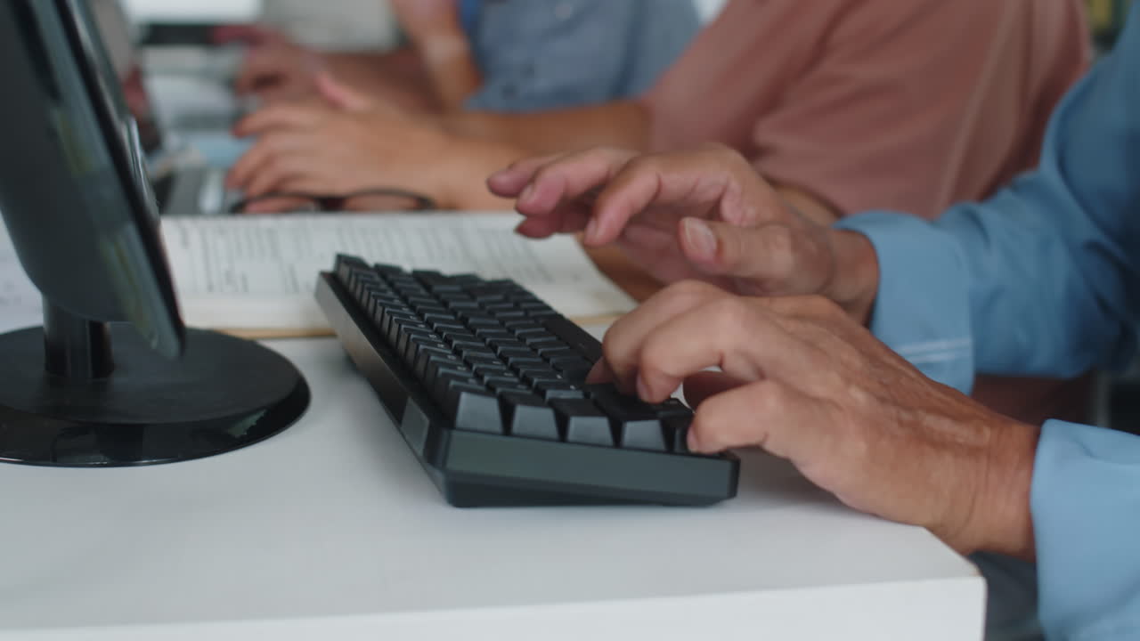 Hands of Senior Man Typing on Keyboard Attending Computer Class