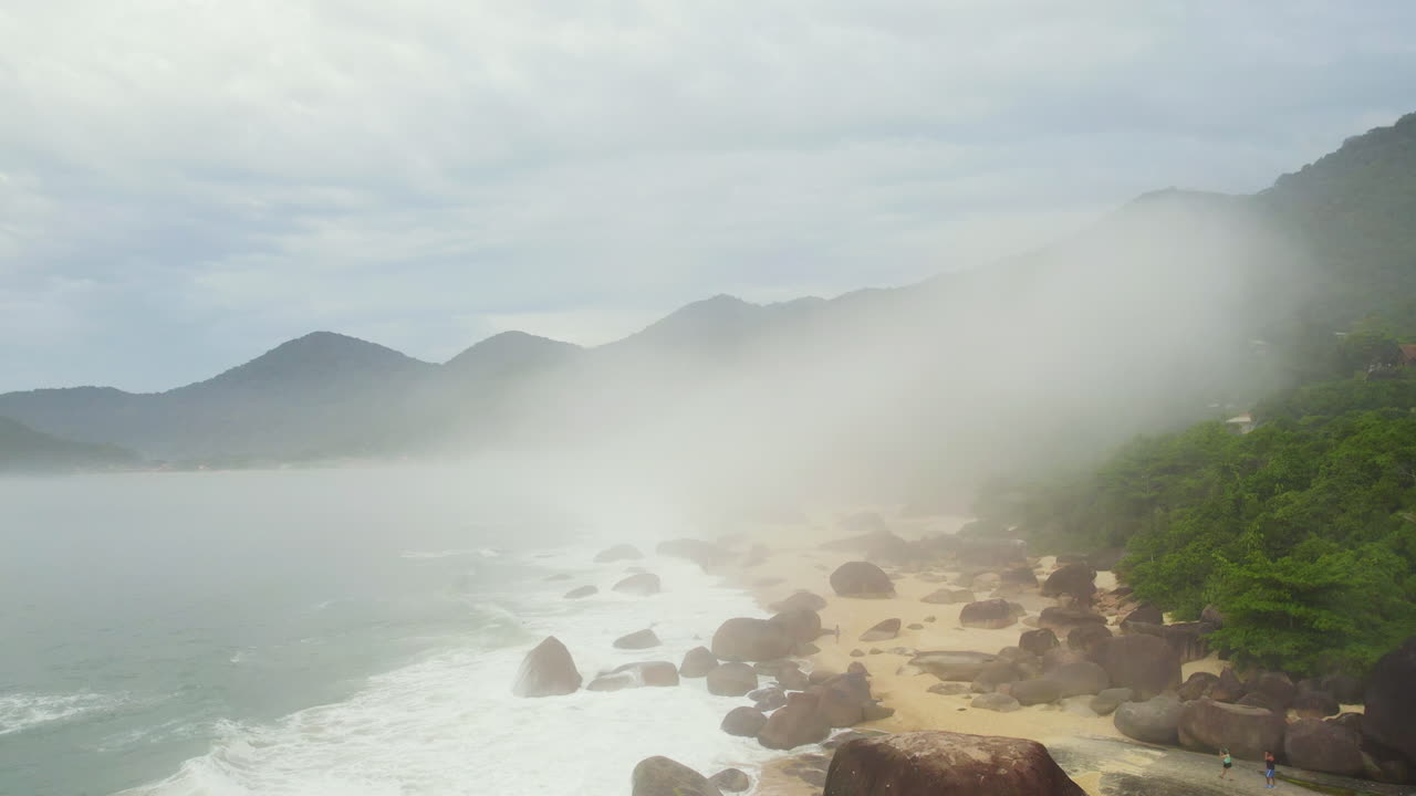 Aerial view over the Trinidade beach, cloudy day with fog in Brazil, South America