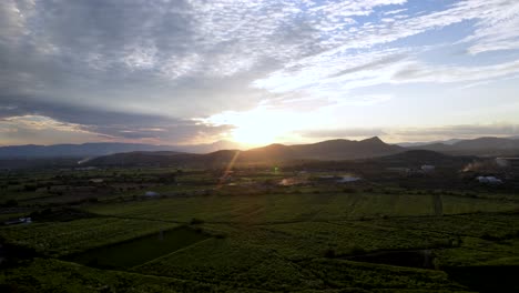 Stunning-aerial-view-of-a-cloudy-sunset-in-Mexico-countryside