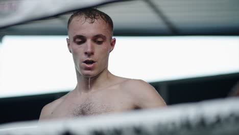 male boxer sweating in the ring