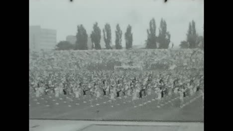 large crowd gathering in a field