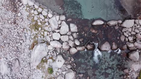 drone on the river in val di mello, italy