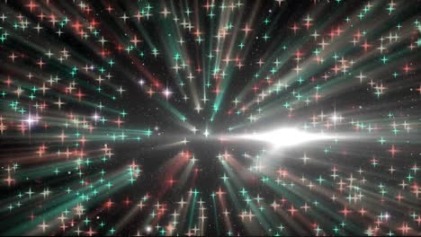 mancha de luz sobre múltiples estrellas que caen contra un fondo negro