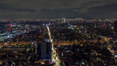 bright lights and busy traffic in mexico city, nighttime aerial hyperlapse