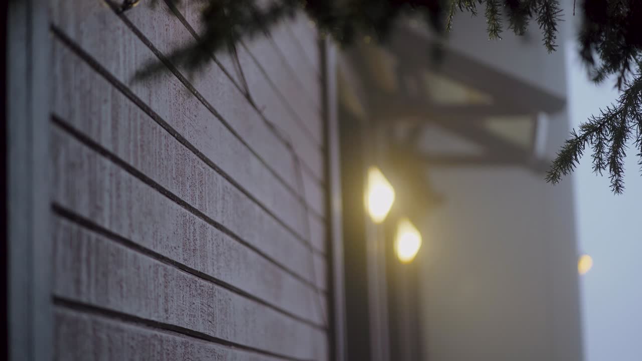 Christmas tree branches, lanterns on the background