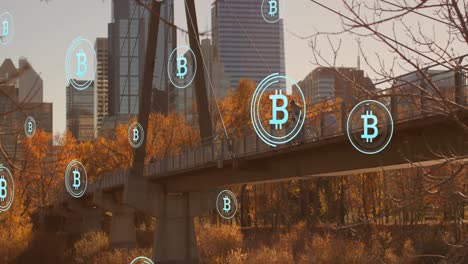 Animación-De-Múltiples-íconos-De-Bitcoin-Flotando-Contra-La-Vista-Del-Puente-De-La-Ciudad