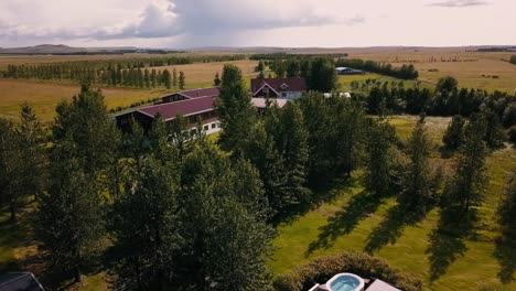 drone shots of of a country side cabin with hot tubs