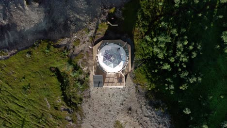 glamping in an acrtic dome in the north of norway, aerial shot. small house for vacation in a beautiful nature.