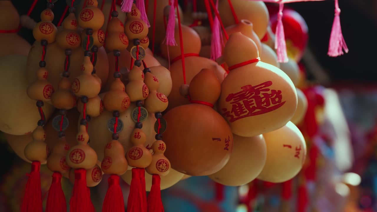 Traditional Chinese Gourds Hanging in a Street Market Stall