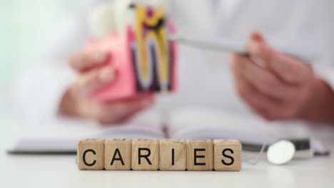 caries dental education with tooth model
