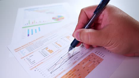 man hands with pen-filling on papers