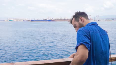 man talking by phone at sea. slow motion.