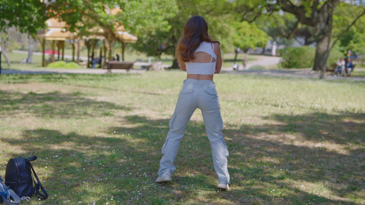 Woman Dancing in a Park