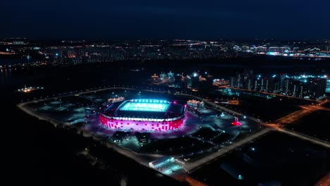 night aerial view of a freeway intersection and football stadium spartak moscow otkritie arena