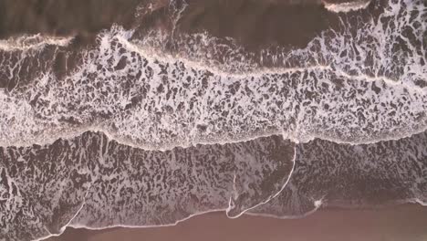 Top-down-view-of-a-sandy-shore-in-the-Caribbean-Sea