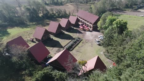 Orbit-Shot-Of-Distinctive-Wooden-House-Cottages-In-Rural-Area,-Mexico