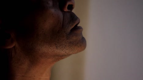 man-praying-to-god-with-face-looking-up-on-grey-background-stock-footage