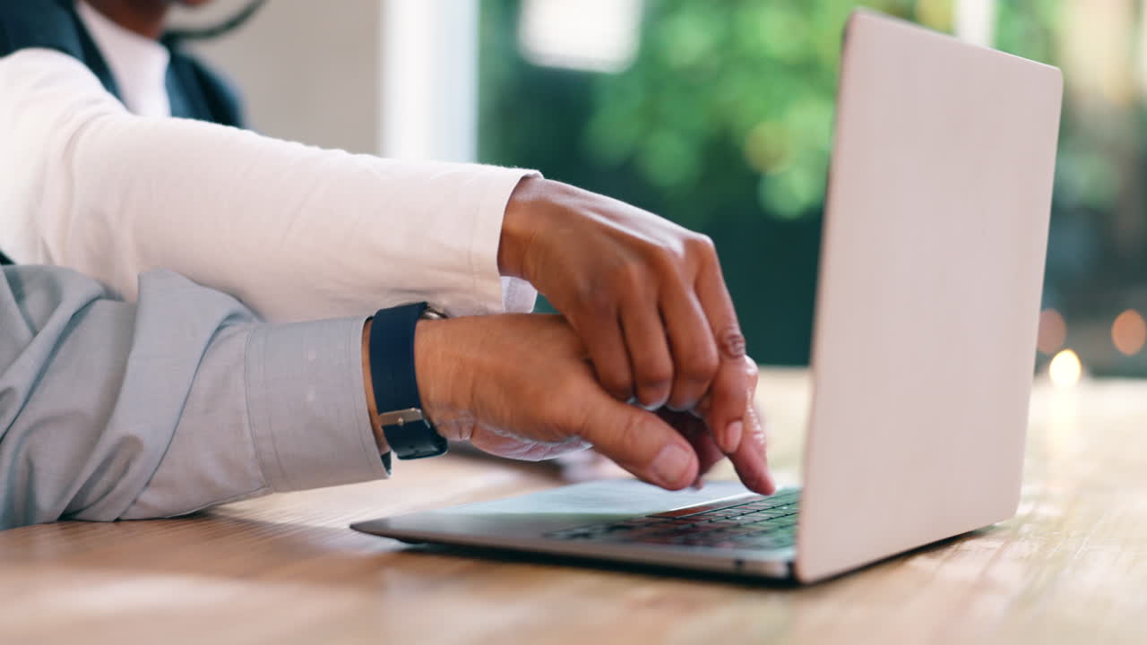 Person Typing on Laptop