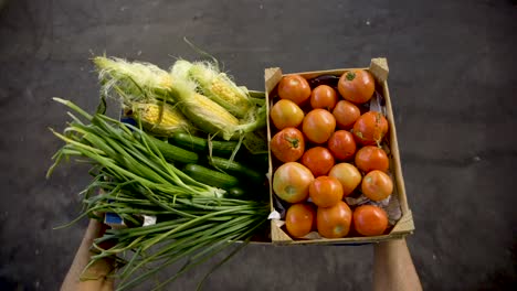 man carrying fresh organic green whole vegetables from hipster farmer's market pov