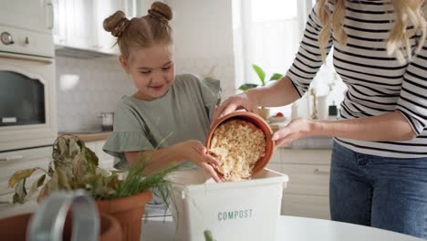 video of mother and daughter doing compost