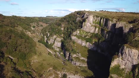 Fly-back-footage-of-gorge-with-hills