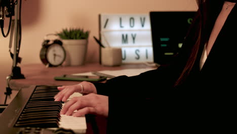 Side-view-of-woman-playing-keyboard