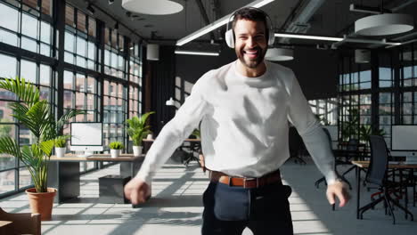 happy man dancing in office