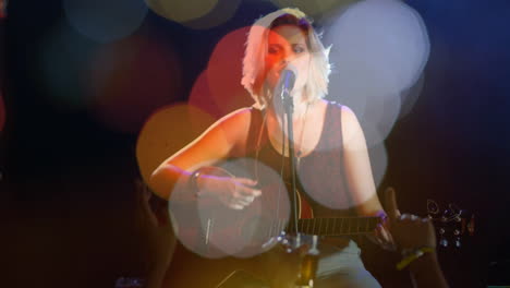 teenage musician strumming acoustic guitar and singing on stage, with floating music note icons