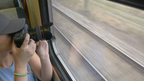 young girl going by train and taking pictures