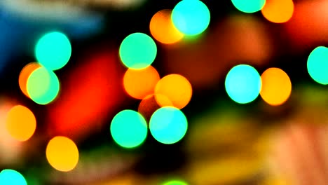 blurred colorful lights. red, green, yellow, orange, blue defocused glittering bokeh festive background.