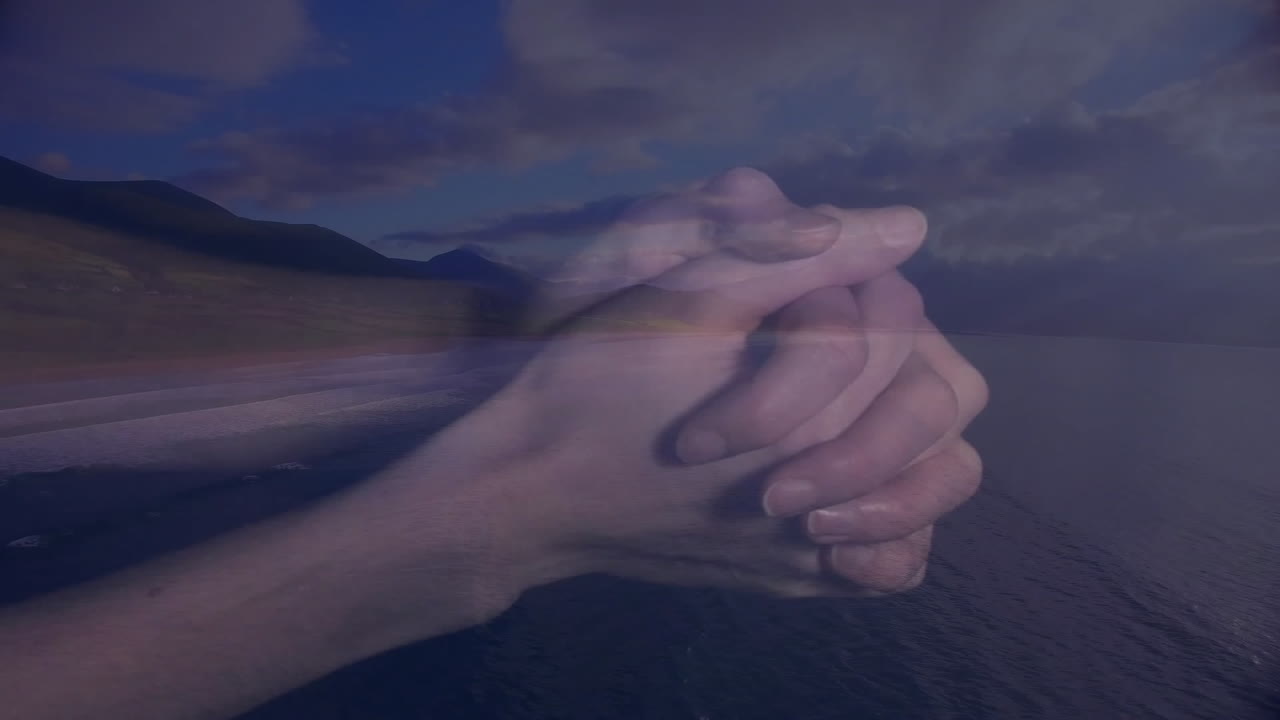 Intertwined hands over scenic mountain and ocean landscape with animation elements
