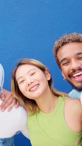 Multiethnic couple smiling at camera and blowing a kiss