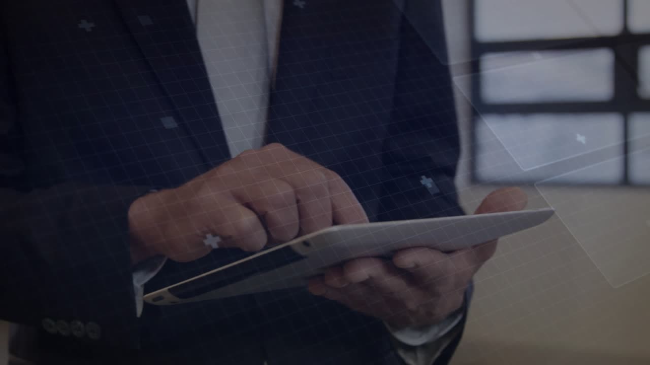 Man in suit tapping tablet screen and animating HUD circuit nodes while analyzing tech data