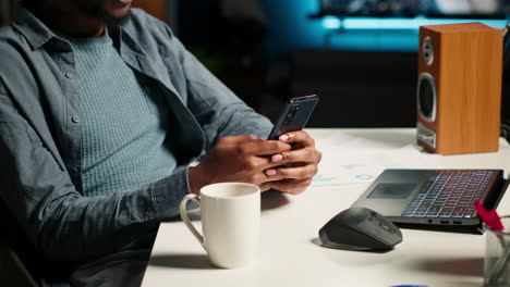 african american man listening to music and browsing webpages