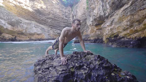 muscular man doing push-ups.healthy lifestyle outdoors physical activity.