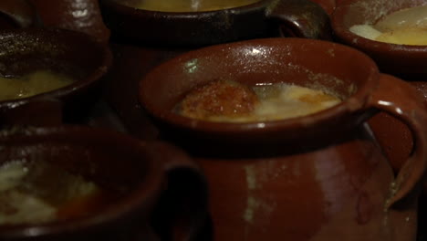 Soup-of-Cocido,-traditional-chickpea-based-stew-from-Madrid,-Spain