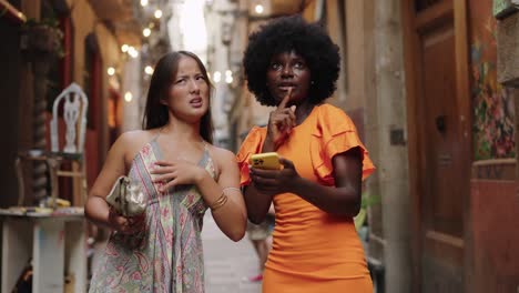 two women exploring a city street