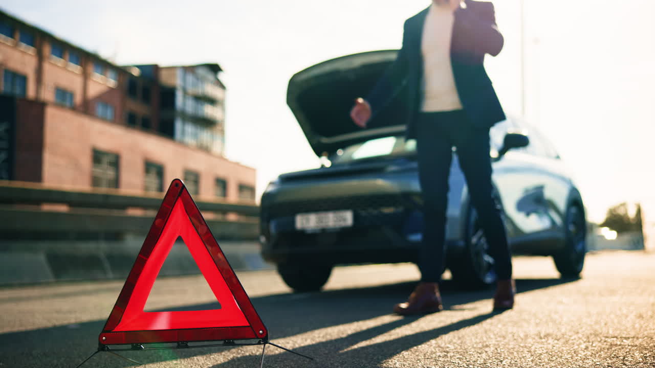 Car Breakdown and Warning Triangle on the Road
