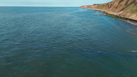 english coastline beach rocky cliffs landscape aerial drone sheringham united kingdom