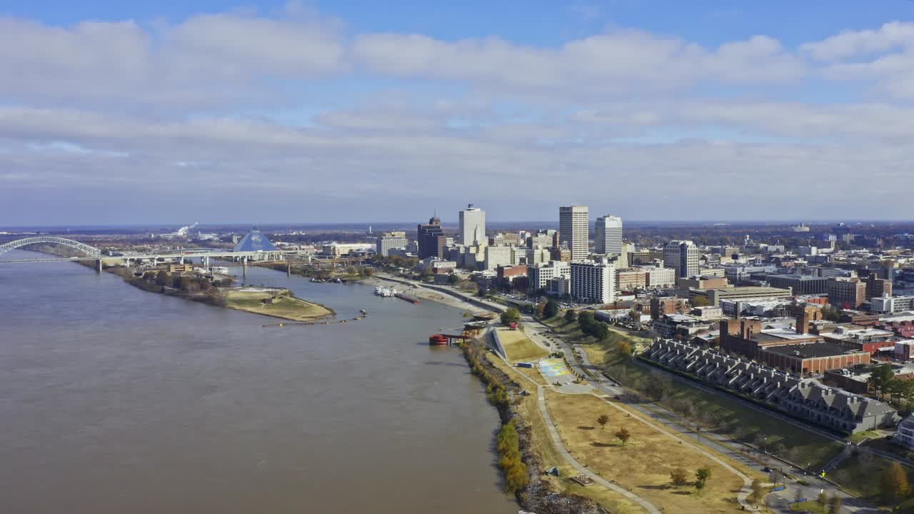 Aerial video of Memphis, Tennessee from above the Mississippi River. Video was recorded under partly cloudy skies in November.