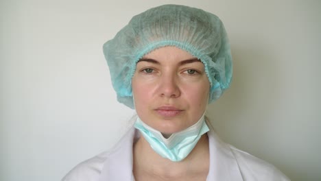 female doctor removes mask. close-up