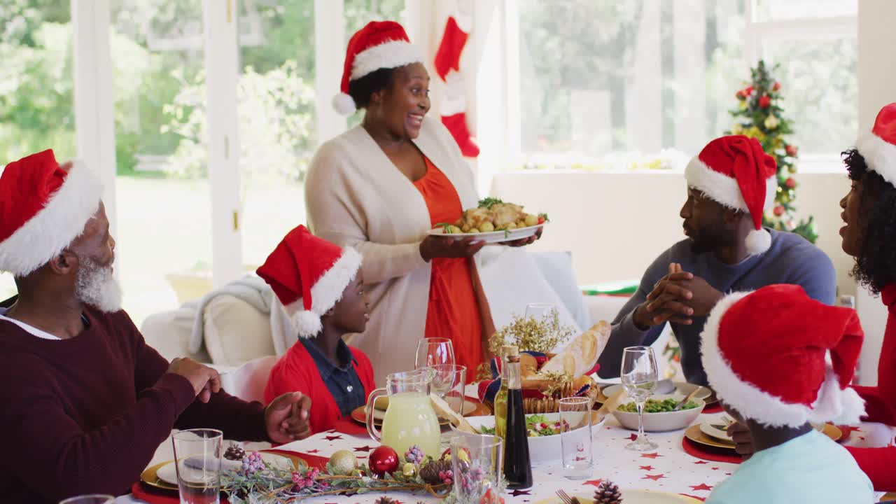 African american family wearing santa hats