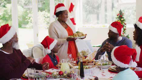 african american family wearing santa hats