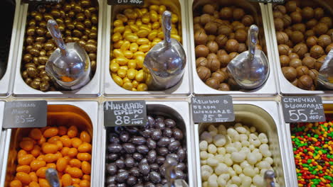 assortment of nuts, seeds, and candies at a market