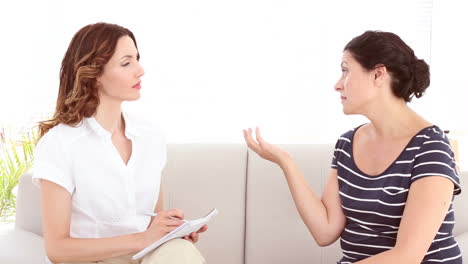 depressed woman talking with her therapist