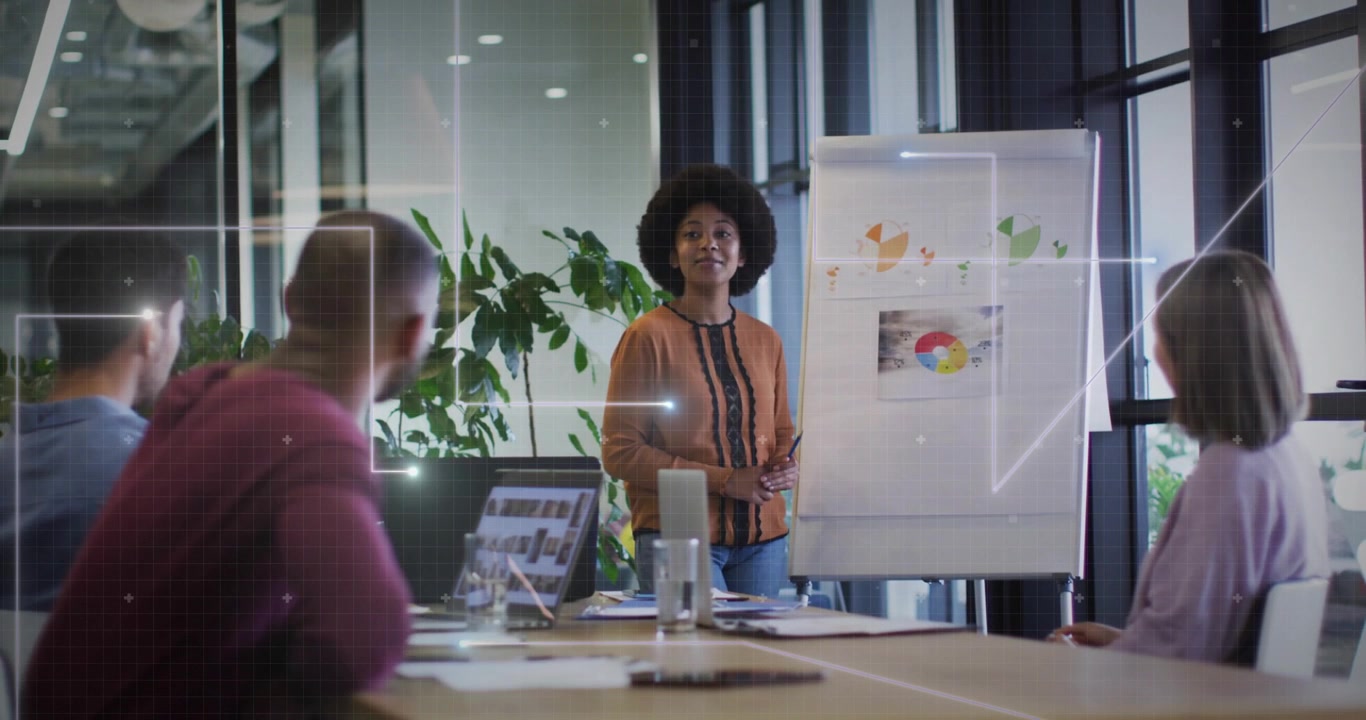 Female presenter pointing at chart, explaining charts for team in business meeting, overlays rising