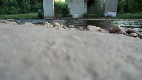 panning from ground to bridge and river