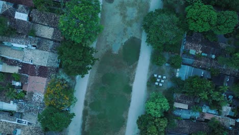 Aerial-Top-Down-Drone-View-of-beach-town-Trancoso-in-Bahia-Brazil-with-rooftops-and-Quadrado