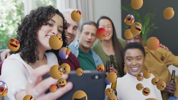 Taking group selfie, friends surrounded by floating emoji animation